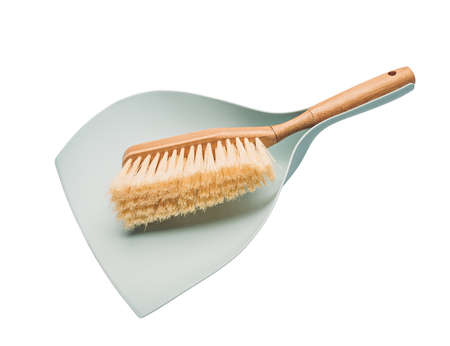 Wooden broom and dustpan isolated on whiteの写真素材