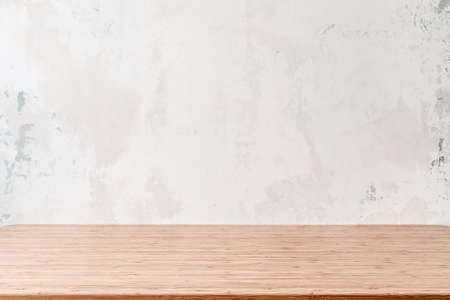 Empty wooden table with grunge cement or concrete wall texture backgroundの写真素材