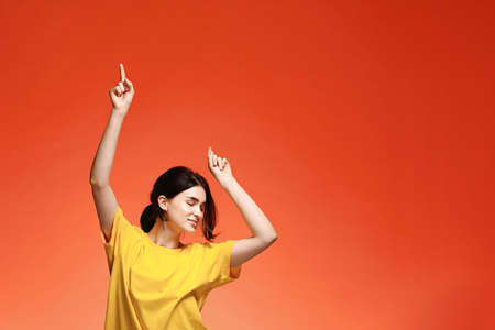 Funny dancing happy young womanの写真素材
