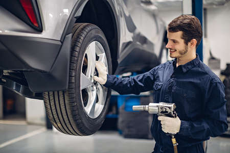 Auto car repair service center. Mechanic at workの写真素材