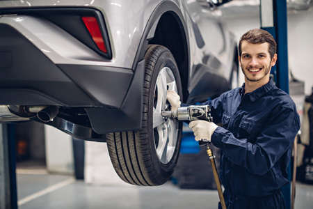 Auto car repair service center. Mechanic at workの写真素材