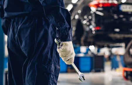 Auto car repair service center. Mechanic at workの写真素材