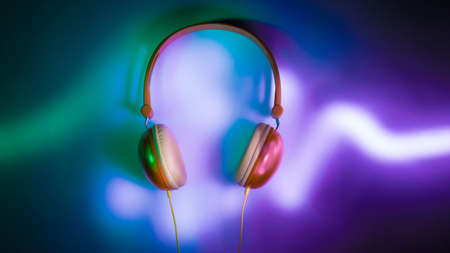 Headphones in dark with neon light audio graphの写真素材