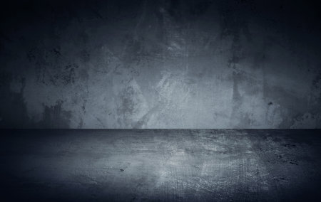 Dark room in beam of light with concrete wall and floor. Texture background imageの写真素材