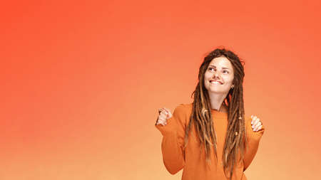 Funny laughing happy young woman with authentic hairstyleの写真素材