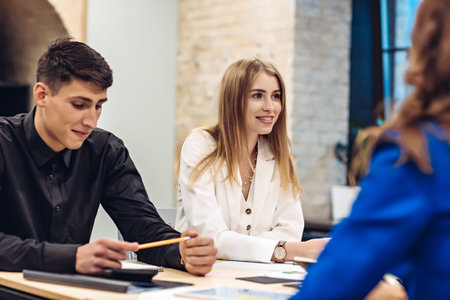 Business people working at table in office
