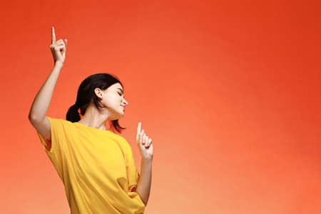 Funny dancing happy young womanの写真素材