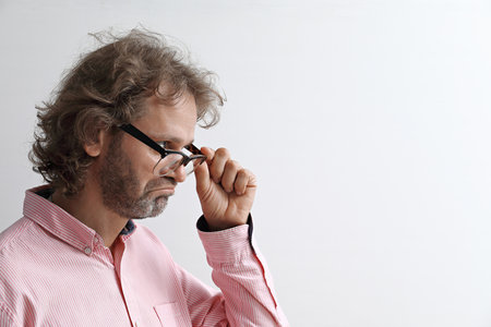 Portrait of a middle-aged man looking in amazement at a copy spaceの写真素材
