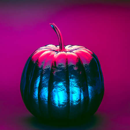 Halloween pumpkin in pink and blue neon lightsの写真素材