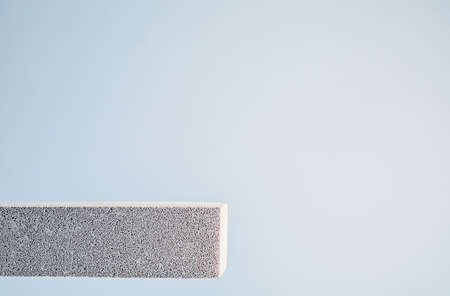 Aerated concrete stone podium on a light backgroundの写真素材