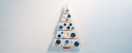 Little cute wooden toy Christmas tree on white backgroundの写真素材