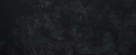 Black or dark gray unobtrusive smooth concrete texture backgroundの写真素材