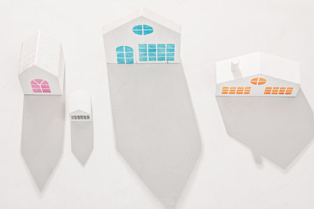 White house models on a white concrete backgroundの写真素材