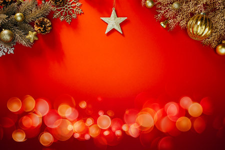 Golden Christmas decorations on a bright red backgroundの写真素材