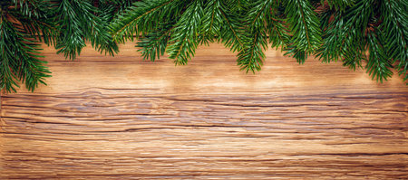 Christmas tree branches on wooden plank. Texture backgroundの写真素材