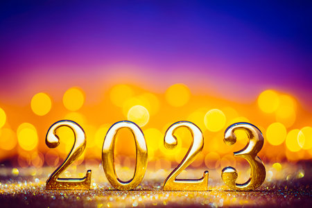 Happy New Year 2023 - golden numbers on glowing glitterの写真素材
