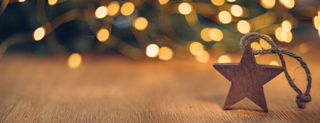 Decorative wooden Christmas star on the background of bokeh lightsの写真素材