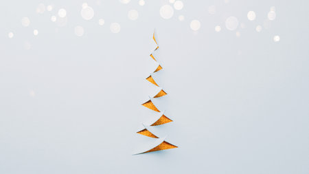 Paper cut Christmas tree with bokeh lightsの写真素材