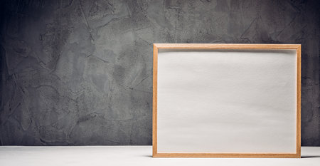 Template with a picture frame on a concrete backgroundの写真素材
