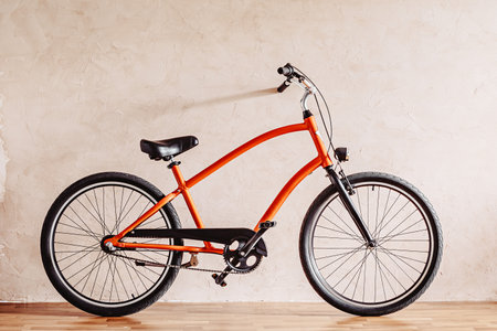 A city bicycle near a plastered wallの写真素材