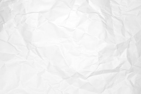 Textured white paper background with crumpled details.の写真素材