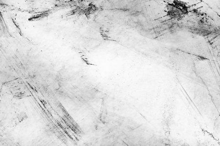 Black white grunge texture with rough brushstrokes and stains.の写真素材