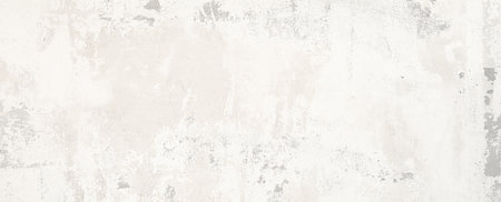 Close-up view of concrete wall rough texture reveals surface with subtle light gray color variations and imperfections.の写真素材