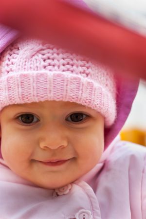 Beautiful baby smiling outdoor in playgroundの写真素材