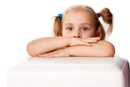 Beautiful girl with folded hands and funny ponytailsの写真素材