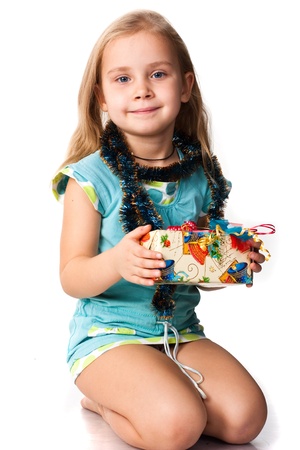 Beautiful girl with a present isolated on whiteの写真素材