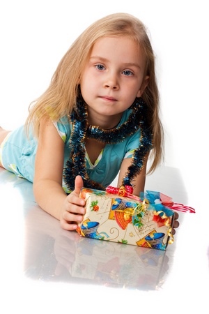 Beautiful girl with a present isolated on whiteの写真素材