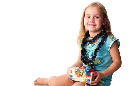 Beautiful girl with a present isolated on whiteの写真素材