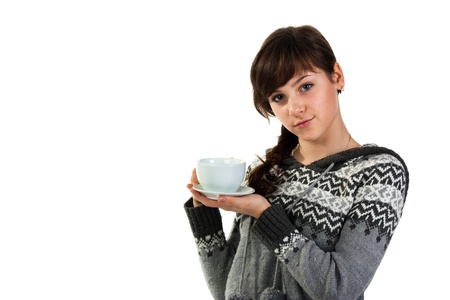 Beautiful girl holding a cup of tea isolated on whiteの写真素材