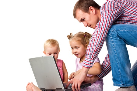 Father with children playing on laptop isolated on whiteの写真素材