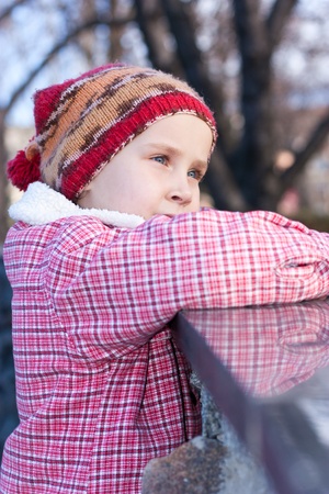 Beautiful baby in a funny hat outdoor の写真素材