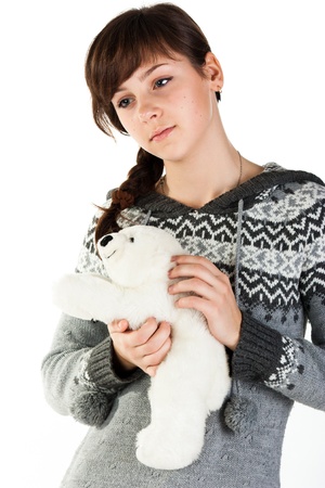 Portrait of a beautiful girl with toy  isolated on whiteの写真素材