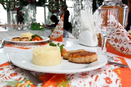 Catering table set with silverware, napkins and glasses at restaurant before party の写真素材