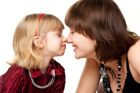 Happy mother and daughter playing isolated on whiteの写真素材