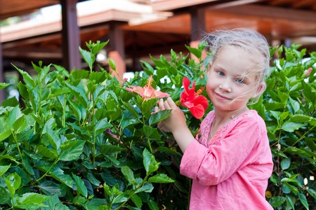 Beautiful girl with flower outdoorの写真素材