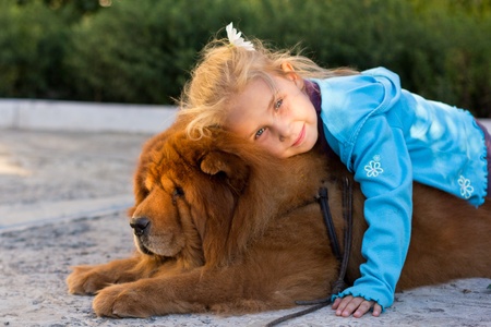 Beautiful girl with the dog outdoorの写真素材