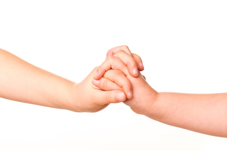 Two kids holding hands together isolated on white  Concept of support, assistanceの写真素材