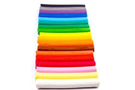 Rainbow colors plasticine bars, modeling clay isolated over white with copyspace for your sample...