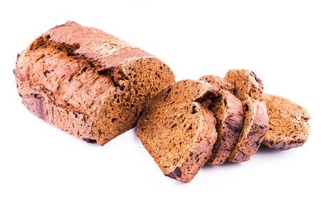 Fresh  sliced homemade whole grain brown bread with cereals isolated on whiteの写真素材