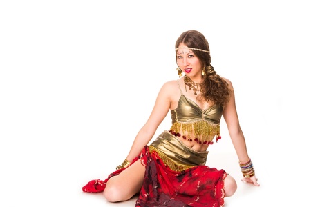 Beautiful eastern belly dancer isolated on whiteの写真素材