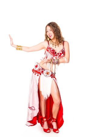 Beautiful eastern belly dancer isolated on whiteの写真素材