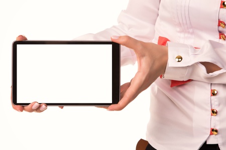 Young attractive business woman holding tablet PC with touch pad isolated on whiteの写真素材
