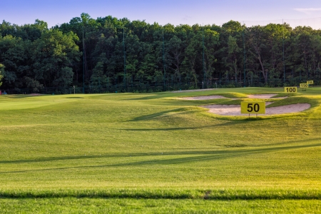 Perfect wavy ground with nice green grass on a golf fieldの写真素材