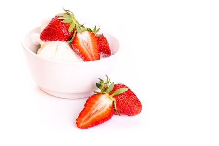 Fresh ice cream in a plate with strawberry isolated on white backgroundの写真素材