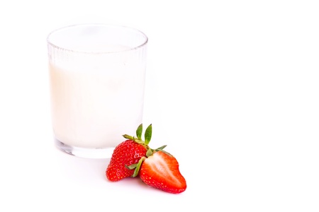 Fresh yougurt in a glass with strawberry isolated on white backgroundの写真素材
