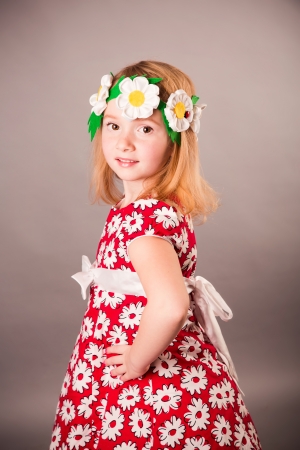 Beautiful girl in a dress posingの写真素材